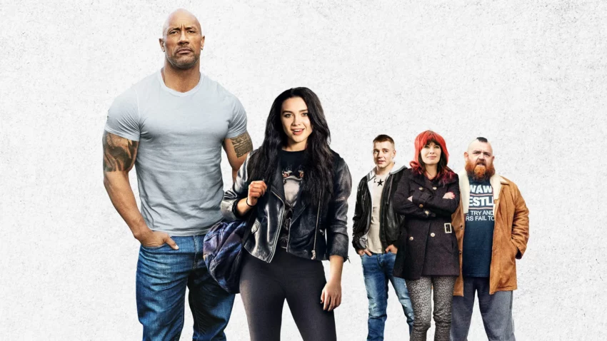 Bannière du film Une famille sur le ring écrit et réalisé par Stephen Merchant avec Florence Pugh, Lena Headey, Nick Frost, Jack Lowden, Vince Vaughn et Dwayne Johnson.